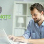 Handsome businessman working with laptop in office | Evernote Review | Everything You Need To Know | Evernote tutorial | mobile device | Featured