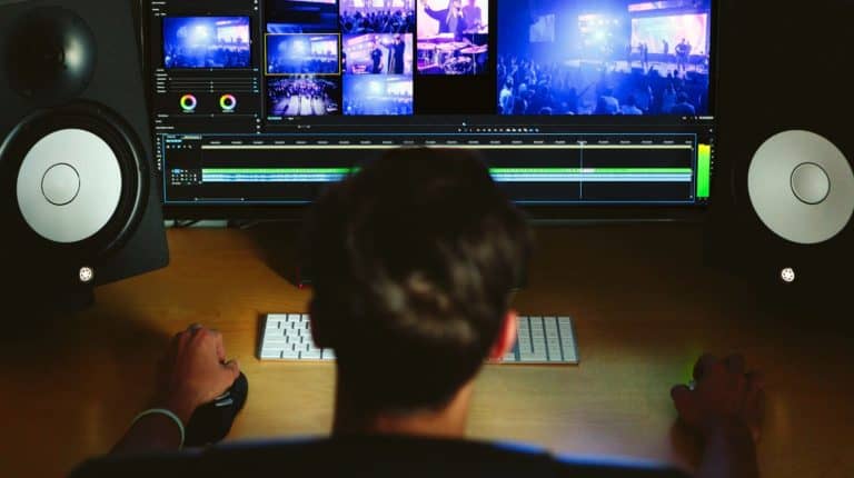 Featured | man editing video | How To Edit Videos on Mac | Check Out These 5 Programs | edit videos for free | best video editing app | iMovie editing