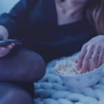 woman with popcorn | What Is Netflix? | Netflix Frequently Asked Questions | netflix subscription | netflix website | netflix account | Featured
