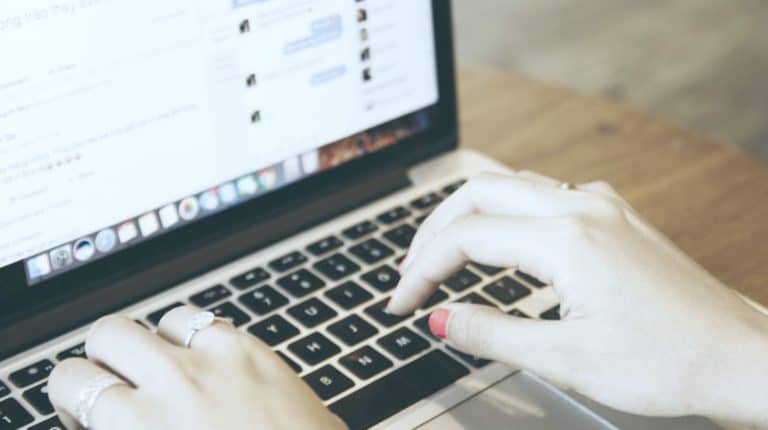 Feature | person using laptop | How To Edit a Post On Facebook After You Posted It | How To Use Programs and Apps | Social Media