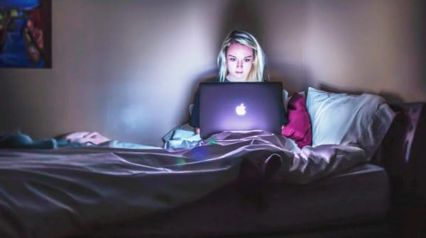 Feature | woman using her laptop | Netflix New Releases To Watch Out For Next Month