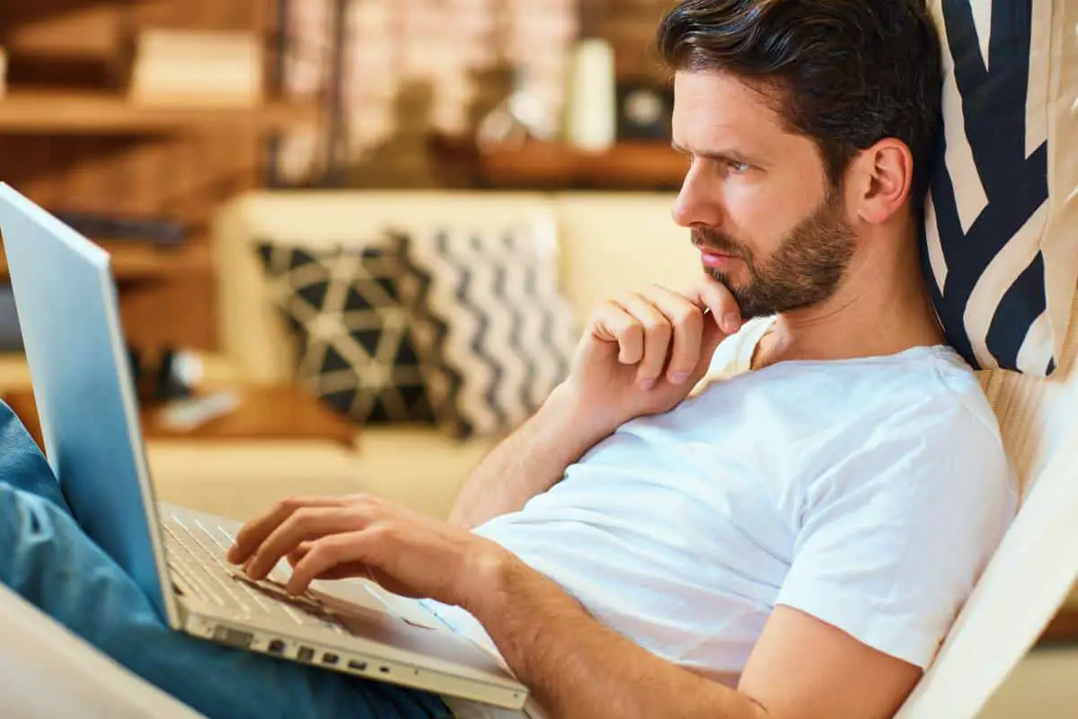 serious man looking at his laptop | Money-Making Side Hustles | Which One Is Best For You?