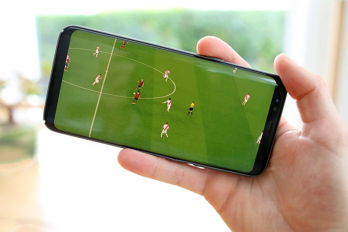 Playing football on mobile phone | There's An App For That | Phone Apps For Anything and Everything