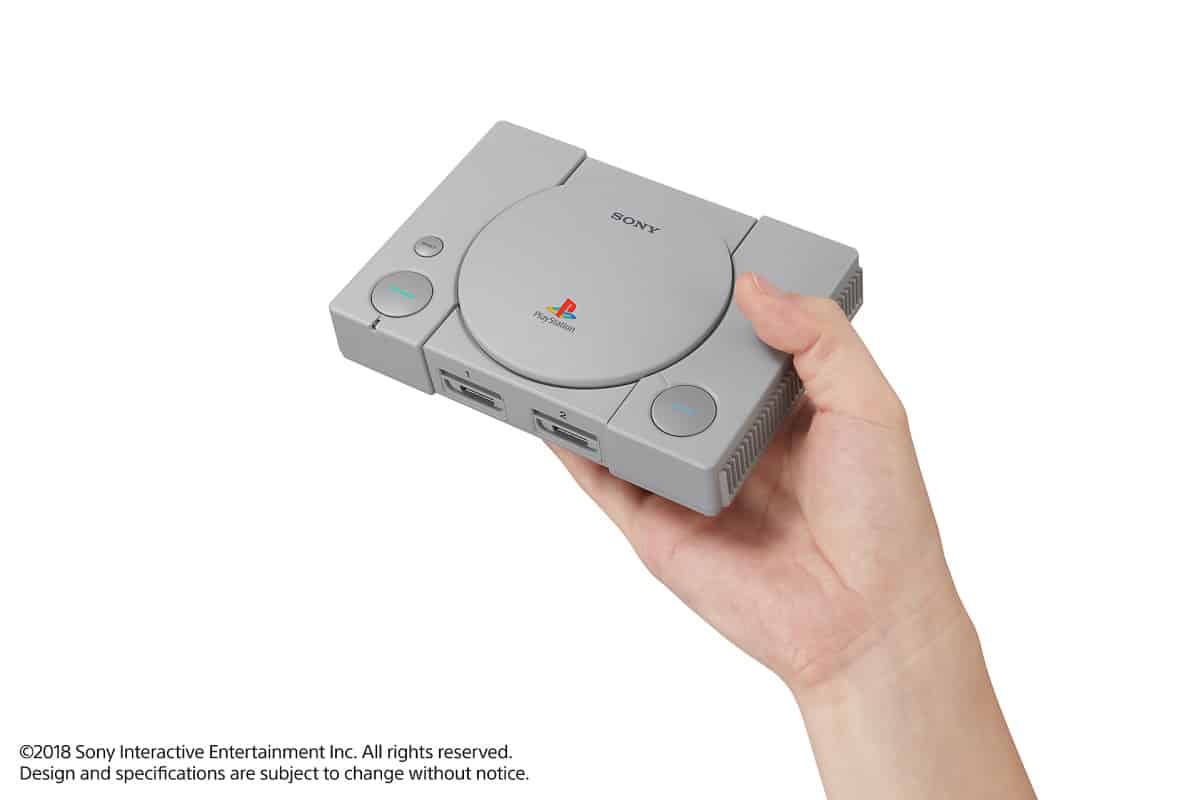 holding PlayStation mini | PlayStation Classic | A First Look At The PlayStation Mini Console