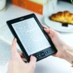 Feature | lady reading on kindle | Amazon's Best Selling Tech Kindle eBooks