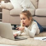 Featured | Shocked little casual girl watching movie | Netflix Viewing History | How To Monitor Viewing Activity Right Now