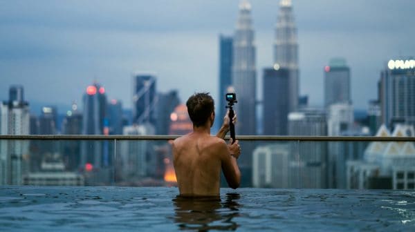 Feature | Man using GoPro in the pool | Top Entertainment Gadgets On Amazon For The Not So Tech-Savvy