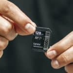 Feature | Man holding memory card| Choosing The Right Memory Card For All Your Gadgets