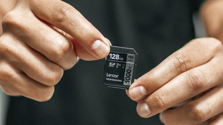 Feature | Man holding memory card| Choosing The Right Memory Card For All Your Gadgets