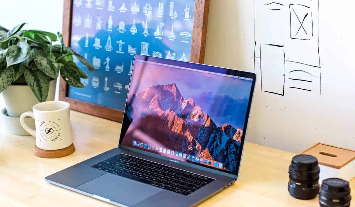 macbook on top of a table | Must-Have Apple Accessories Available on Amazon
