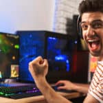 Feature | Portrait ecstatic gamer guy headphones | The Ultimate Guide To PC Games
