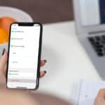 Feature | Person holding iphone | How To Delete Multiple Contacts On Your iPhone Easily