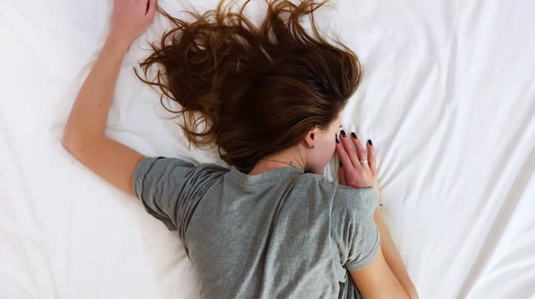 Feature | White sheet bed room people girl | Monitor Sleep With These Sleep Tracker Apps