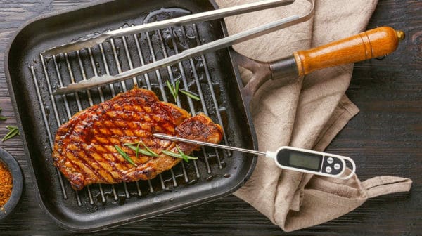 Grilled Steak Striploin on pan and meat thermometer | Top Digital Meat Thermometers For Grilling The Perfect Steak | best digital meat thermometer | Featured