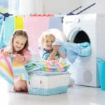 Kids doing chores in laundry room