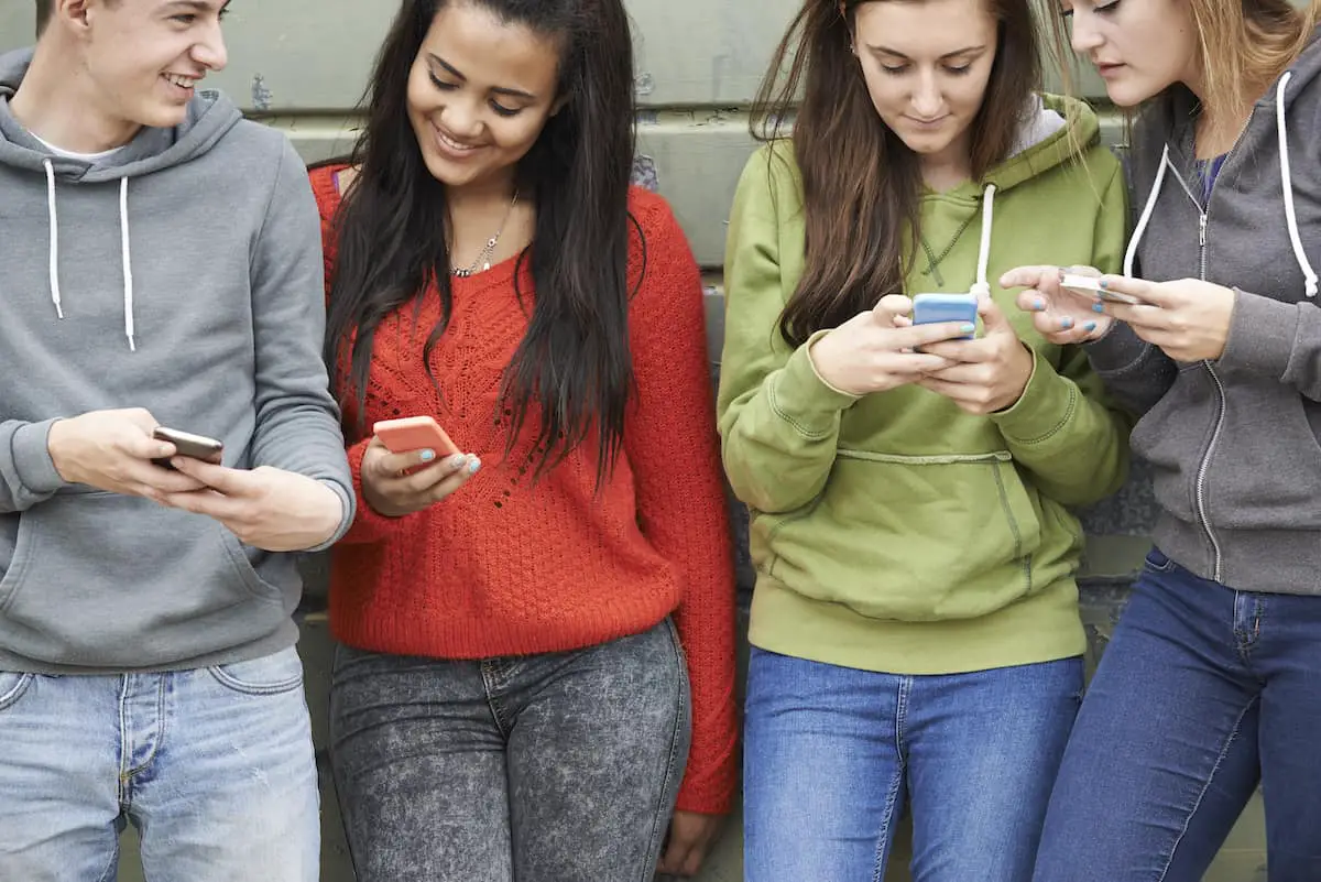 Teenagers on mobile phones